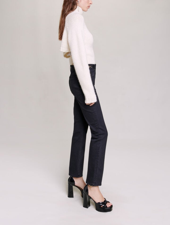 Jeans with curb chains and fringing